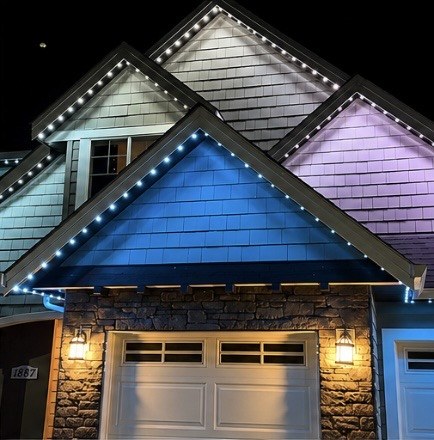 House gables with white, blue, and purple puck lights
