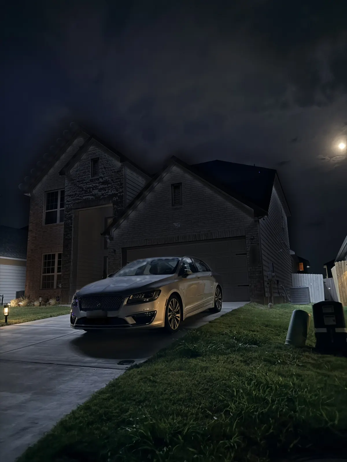 Same house at night before permanent lights